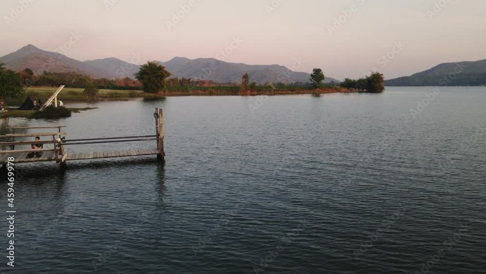 Tourists canoeing on the lake and mountian range view in countryside at Lam Taphoen reservoir Tourists canoeing on the lake and mountian range view in countryside at Lam Taphoen reservoir