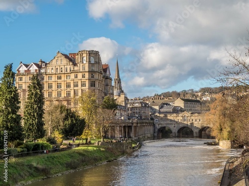 the picturesque horseshoe weir at Pulteney Bridge built in the 1600s to prevent flooding in Bath Somerset England