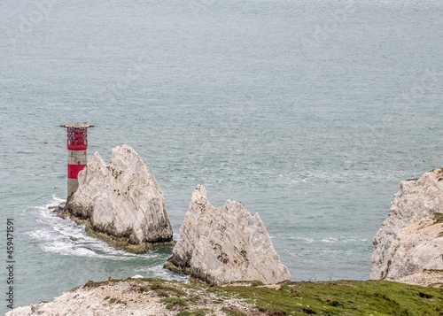 The Needles Lighthouse on the outermost of chalk rocks at The Needles on The Isle of Wight Hampshire, England photo