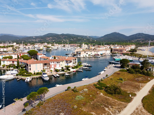 Aerial view on small houses and sailboats of Port Grimaud and port Cogolin, French Riviera, Provence, France © barmalini