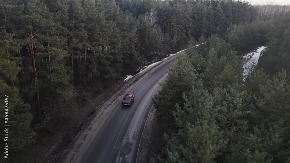 drone moves along the road on the sides of which there is a forest drone moves along the road on the sides of which there is a forest