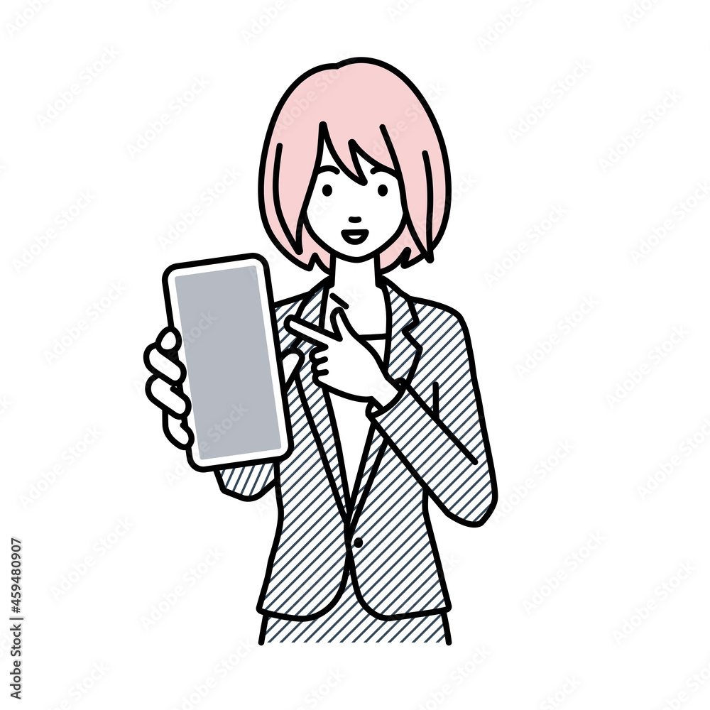 立ってスマートフォンを指差してこちらに向けて見せているスーツの女性 立ってスマートフォンを指差してこちらに向けて見せているスーツの女性