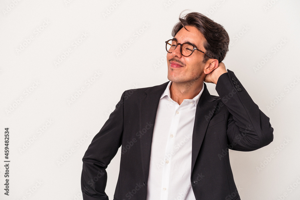Young mixed race business man isolated on white background touching back of head, thinking and making a choice. Young mixed race business man isolated on white background touching back of head, thinking and making a choice.