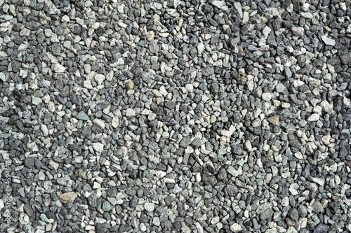 gray gravel stones abstract background. Pebble backdrop. crushed stones, construction rocks texture. top view
