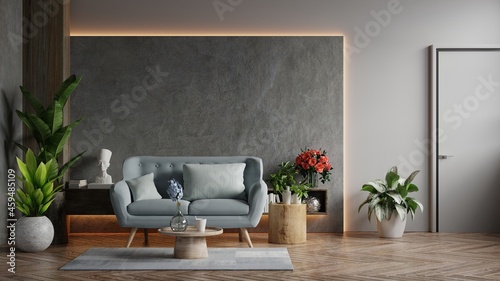 Living room loft in industrial style with blue sofa on empty concrete wall background.