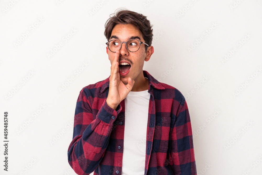 Young mixed race man isolated on white background shouting excited to front. Young mixed race man isolated on white background shouting excited to front.