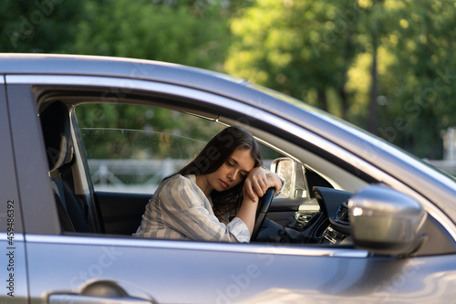 Depressed young woman driver sitting inside car, feeling doubtful confused about difficult decision suffering from personal psychological problem, burnout, quarrel break up with boyfriend, life crisis © DimaBerlin