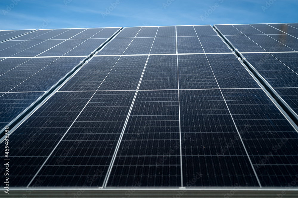 Sun energy with solar panels close up. View on blue sky Sun energy with solar panels close up. View on blue sky