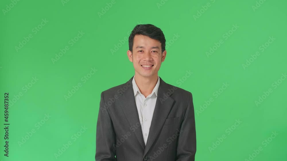 Young Asian Business Man Warmly Smiling On Green Screen Background In The Studio
Young Asian Business Man Warmly Smiling On Green Screen Background In The Studio