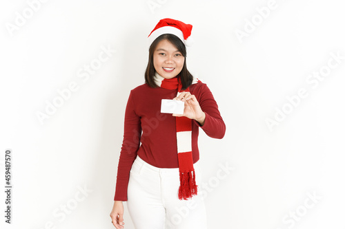 Showing Blank Credit Card of Beautiful Asian Woman Wearing Red Turtleneck and Santa Hat Isolated On White Background