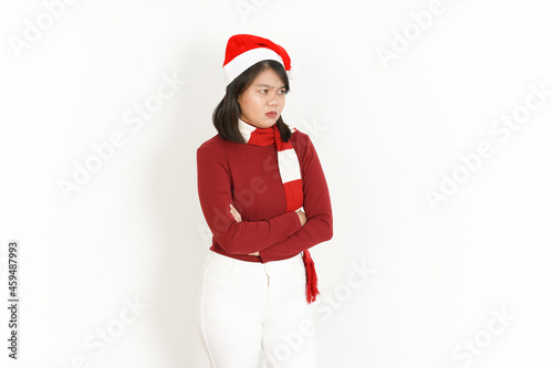 Angry Gesture Face Expression of Beautiful Asian Woman Wearing Red Turtleneck and Santa Hat Isolated On White Background