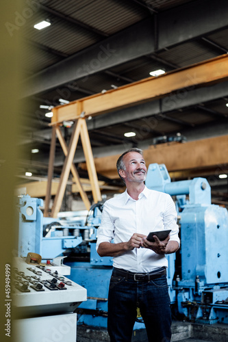 Wallpaper Mural Male professional with digital tablet standing at steel mill Torontodigital.ca