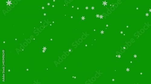 Falling shaped snowflakes on a green background. Christmas motion graphic video animation. Chroma key wallpaper photo