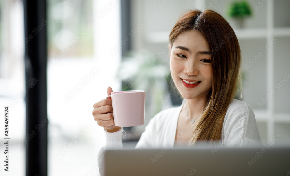 Portrait of smiling beautiful business asian woman with working in modern office desk using computer, Business people employee freelance online marketing e-commerce telemarketing concept. Portrait of smiling beautiful business asian woman with working in modern office desk using computer, Business people employee freelance online marketing e-commerce telemarketing concept.