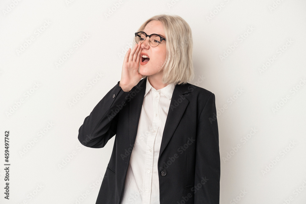 Young caucasian business woman isolated on white background shouting and holding palm near opened mouth. Young caucasian business woman isolated on white background shouting and holding palm near opened mouth.