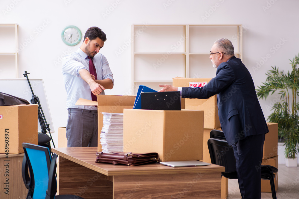 Two male employees in relocation concept