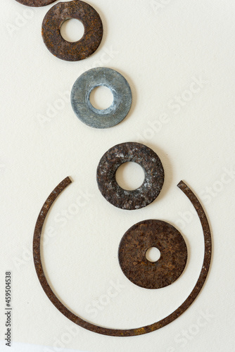 metal objects loosely arranged on a paper background photo