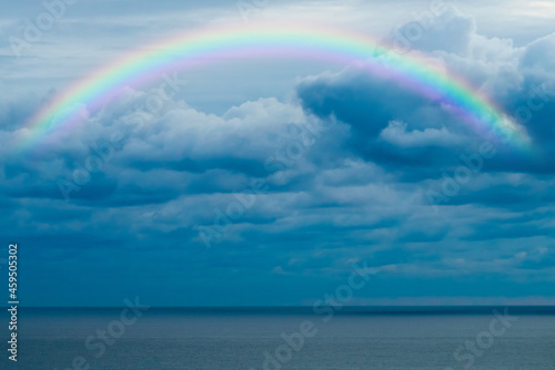 Beautiful sea with a rainbow in the sky © EwaStudio