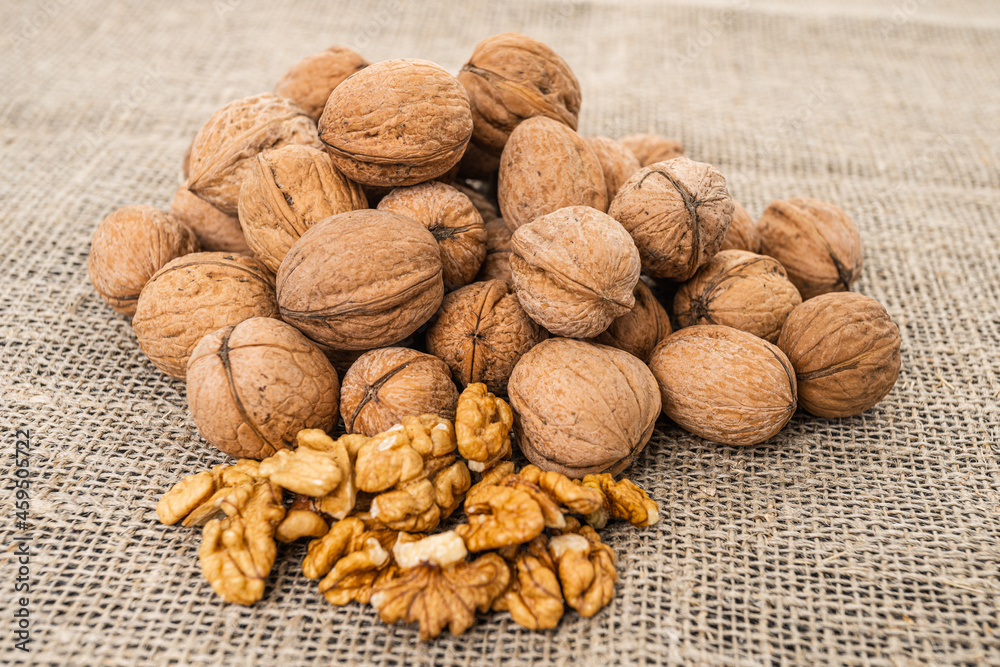 Close up view of walnuts on tabletop Close up view of walnuts on tabletop