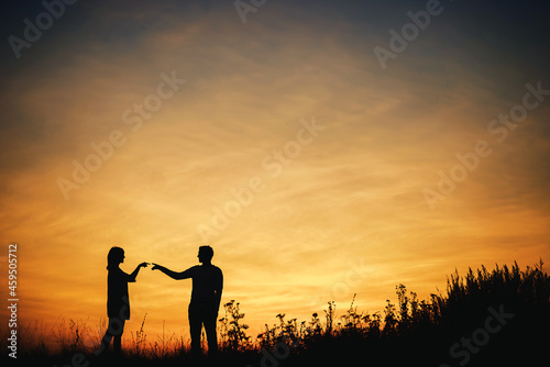 Silhouette of a couple of lovers at sunset