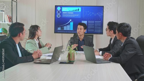 Asian Executive Say Good News To His Employees, They'Re Happy And Celebrate With Clapping Hands
 photo