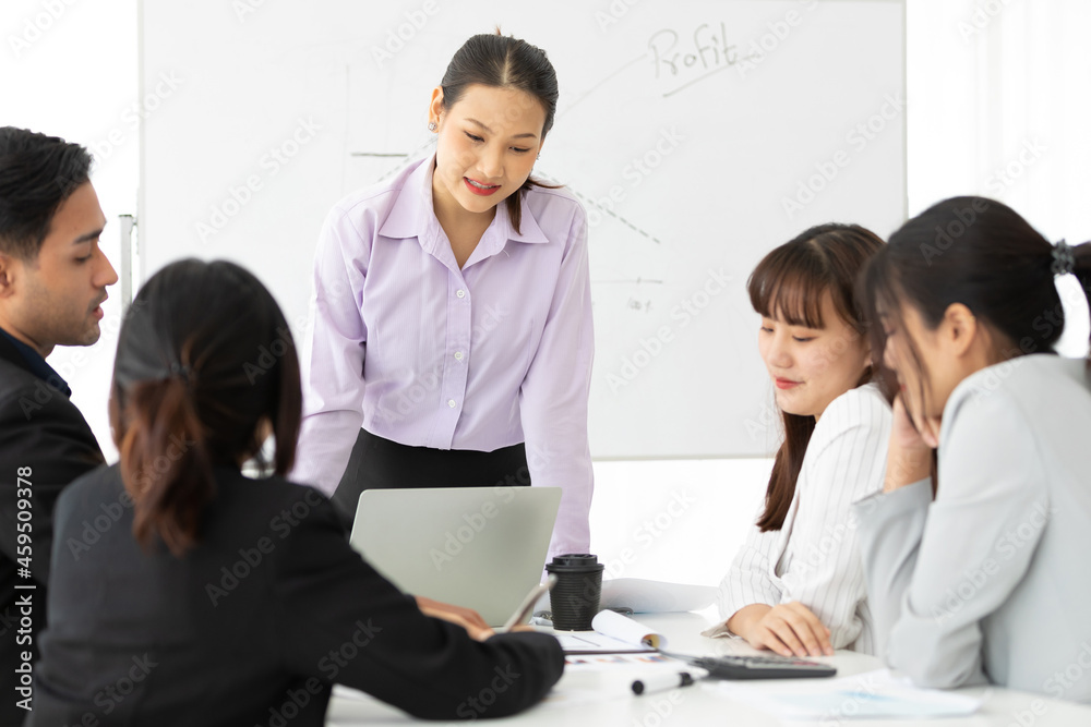 young businesswoman seminar or meeting and presentation about work project on whiteboard