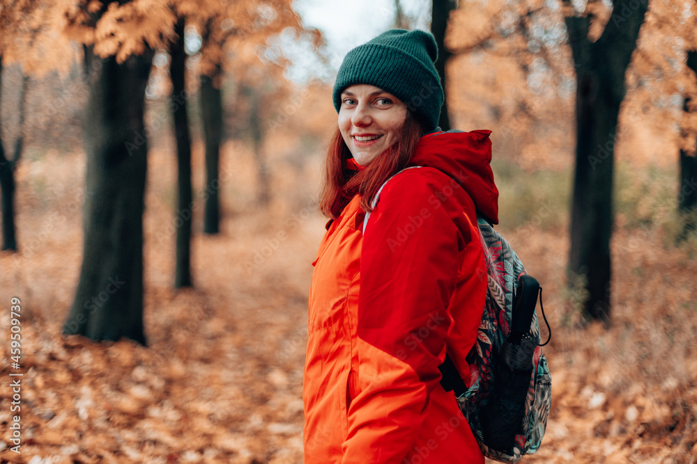 Back view Attractive caucasian smile woman hiking trip backpack in autumn forest, extreme lifestyle, freedom concept. Back view Attractive caucasian smile woman hiking trip backpack in autumn forest, extreme lifestyle, freedom concept.