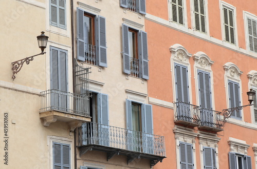 Typical Building Facades with Balconies  Grey Shutters and Lanterns in Rome  Italy