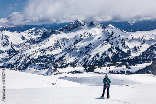 A hiker observing mountains in Mount Rainier National Park