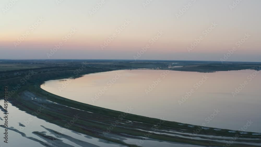 The estuary of the Dniester River in the village of Kurortny region at sunset from a bird's eye view. Quiet sea and estuary without waves. clear evening sky. The estuary of the Dniester River in the village of Kurortny region at sunset from a bird's eye view. Quiet sea and estuary without waves. clear evening sky.