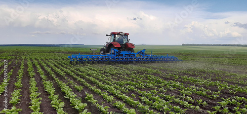 Photography Spring farming concept; one tractor with cultivator in agricultural field