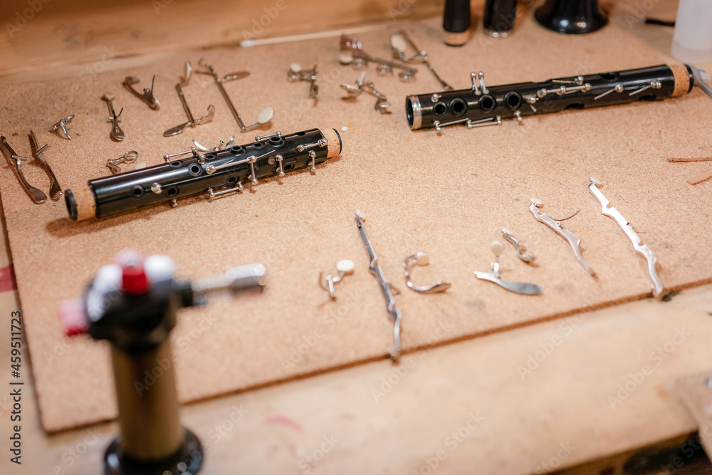 musical instrument maintenance, clarinet cleaning in wind instrument workshop