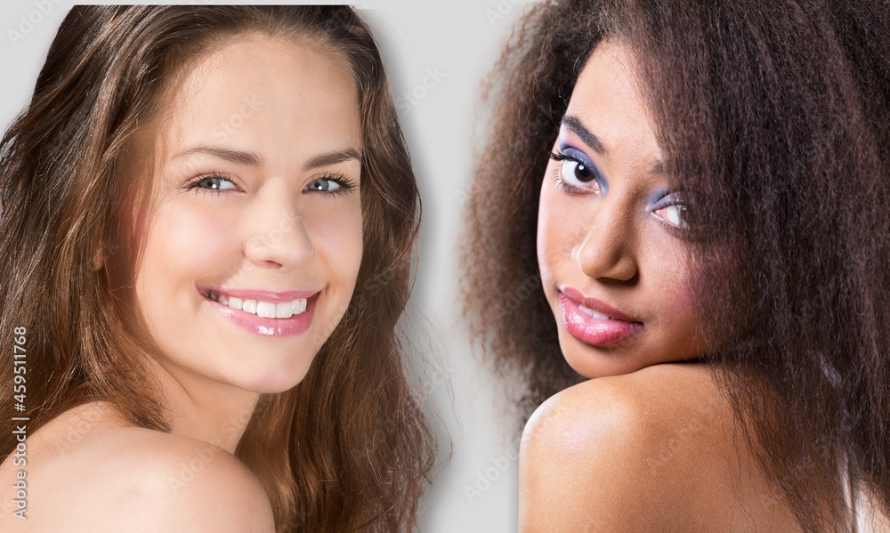 Portrait of two attractive women bonding flawless skin complexion Portrait of two attractive women bonding flawless skin complexion