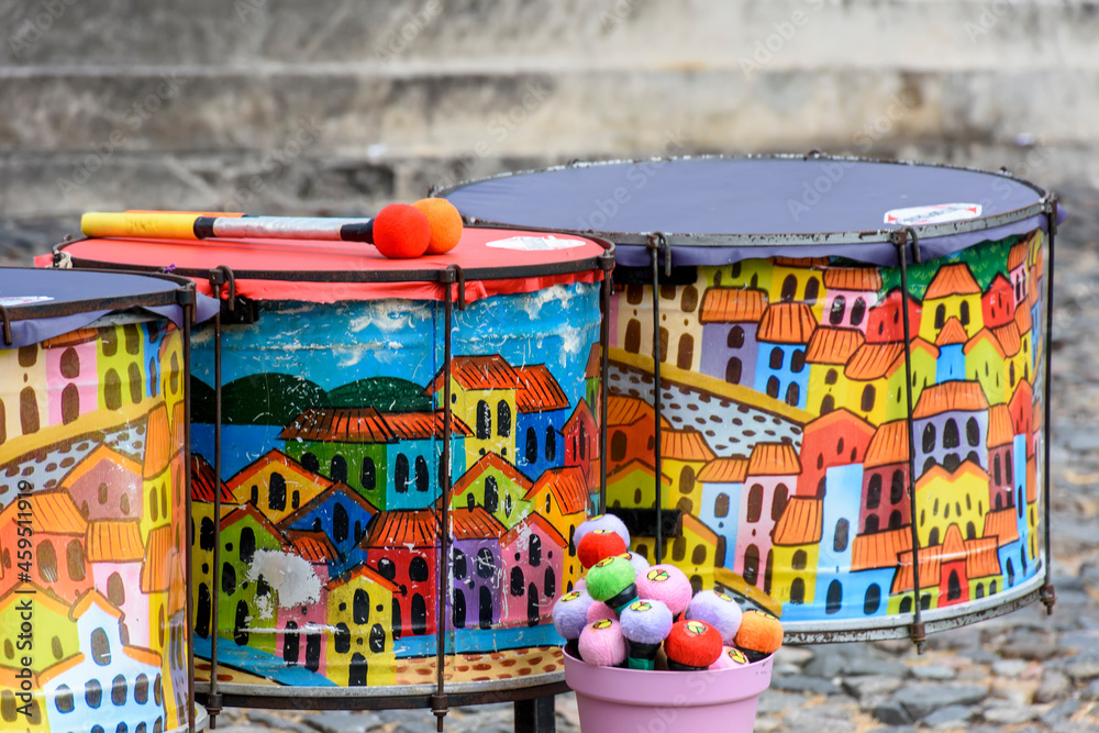 Fototapeta premium Ethnic and colorful decorated set of drums hand made painted on the streets of Pelourinho, Salvador, Bahia