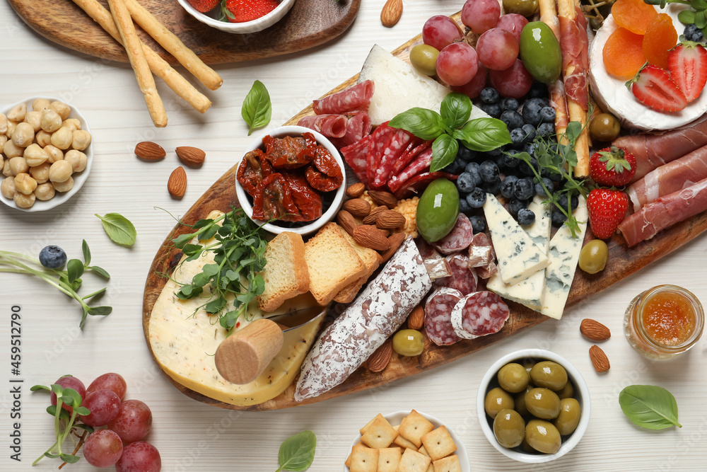 Set of different delicious appetizers served on white wooden table, flat lay Set of different delicious appetizers served on white wooden table, flat lay