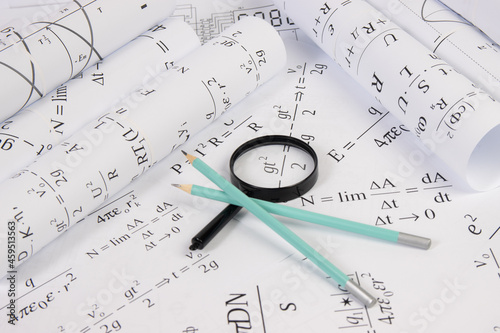 paper math electrical formulas  magnifier and pencils
