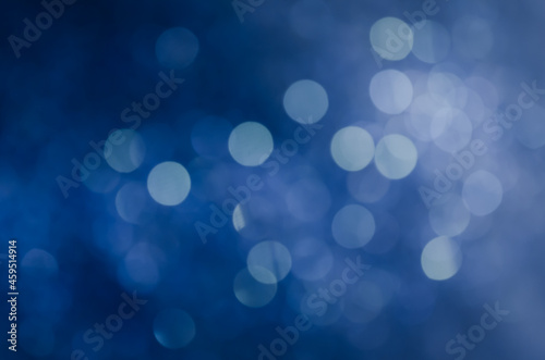abstract blue bokeh glitter sparkle background.