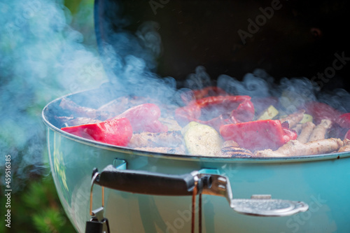 grilled vegetables and chicken sausages on mangal barbeque grill