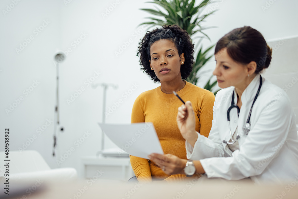 Doctor and patient in medical office, talking about treatment. Doctor and patient in medical office, talking about treatment.