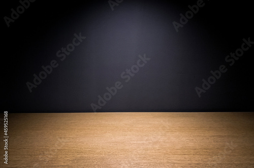 Empty wooden table with free space on a dark background  © VetalStock