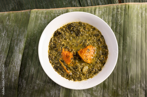 Callaloo Trinidad vegan  food restaurant photo top down view on banana leaf 