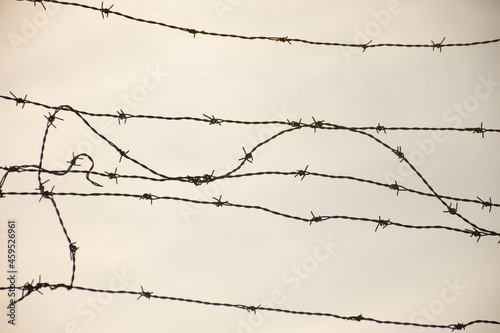 Barbed wire fence to protect and defend a private area.