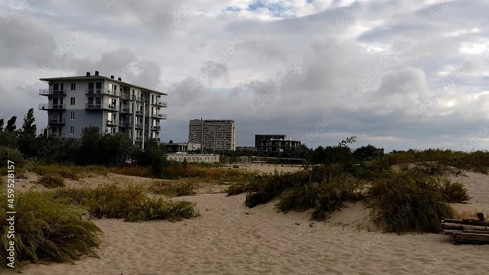 Gloomy and stormy beach scene, clouds float quickly over the Black Sea beach, mobile video Gloomy and stormy beach scene, clouds float quickly over the Black Sea beach, mobile video