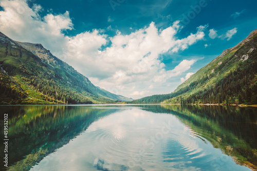 Tatra National Park  Poland. Circles On Water On Surface Of A Calm Lake. Famous Mountains Lake Morskie Oko Or Sea Eye Lake In Summer Evening. Beautiful Nature  Scenic View Of Five Lakes Valley. UNESCO