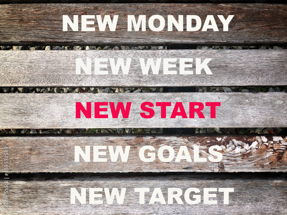 Wooden background with phrase NEW MONDAY, NEW WEEK, NEW START, NEW GOALS and NEW TARGET Wooden background with phrase NEW MONDAY, NEW WEEK, NEW START, NEW GOALS and NEW TARGET