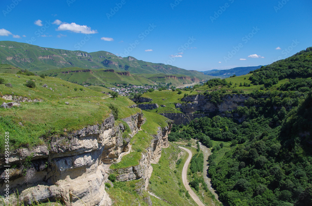 Above of Tyzyl Gorge. Beautiful view of the mountainous landscape and valley of river at sunny day. Nature and travel. Russia, Caucasus, Kabardino-Balkaria