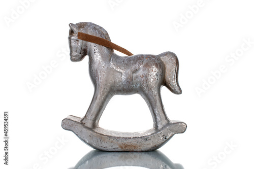 One metal decorative figurine of a child's horse, close-up, isolated on white.