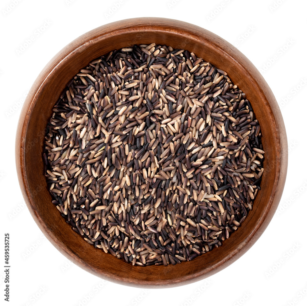 black rice grain in wood bowl isolated on white background