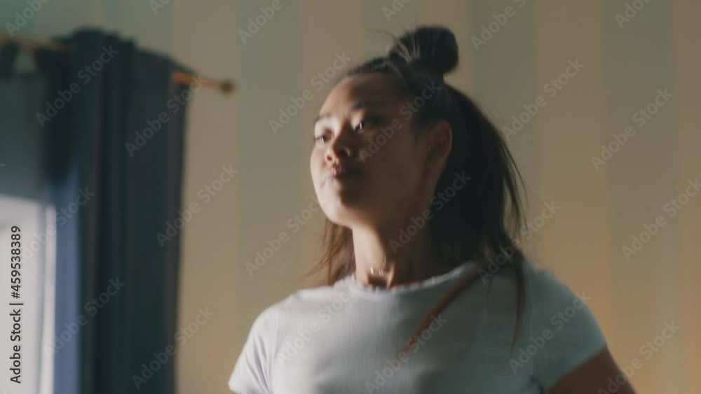 Asian sportswoman running at home Asian sportswoman running at home