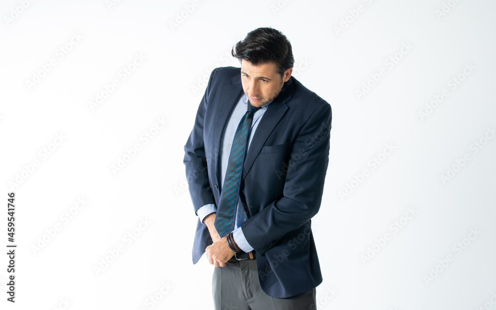 Portrait handsome smart Caucasian male businessman dressing and tying necktie with formal suit, self preparing for working, posing with success, standing on isolated white background cutout. Portrait handsome smart Caucasian male businessman dressing and tying necktie with formal suit, self preparing for working, posing with success, standing on isolated white background cutout.